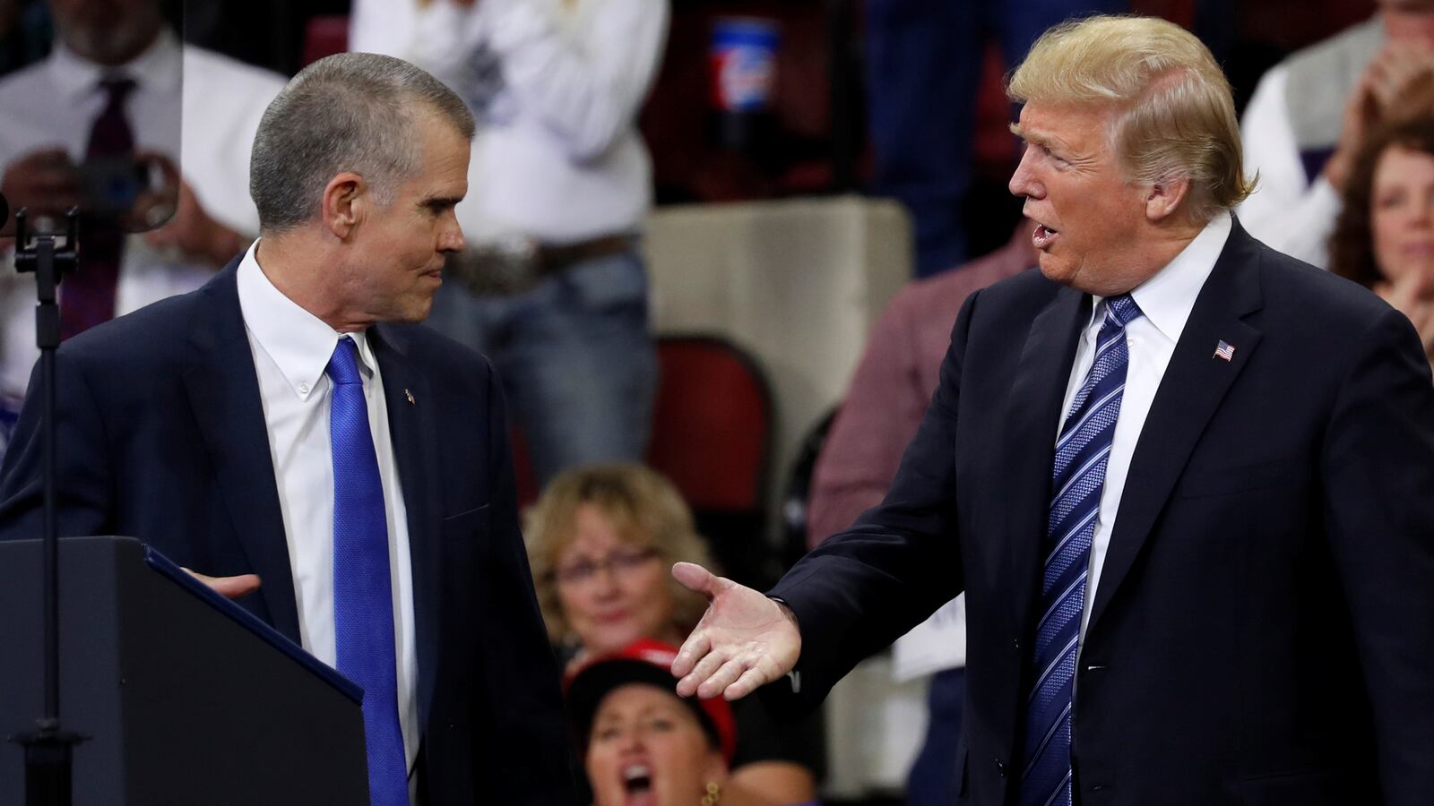 U.S. President Donald Trump extends his hand to Republican Senate candidate Matt Rosendale.