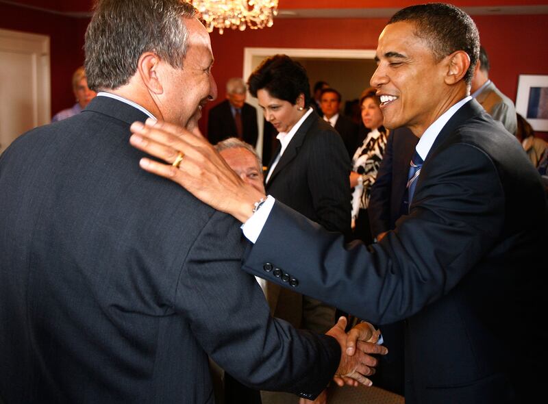 Barack Obama (D-IL) (R) greets former Treasury Secretary Larry Summers