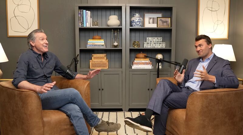 Gavin Newsom interviews Charlie Kirk on his podcast in 2025.
