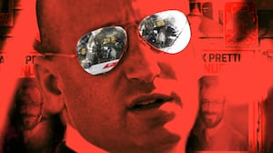 Illo illustration of Stephen Miller with posters of Alex Pretti behind him, all with a red filter, with images of DHS and ICE in Miller's glasses