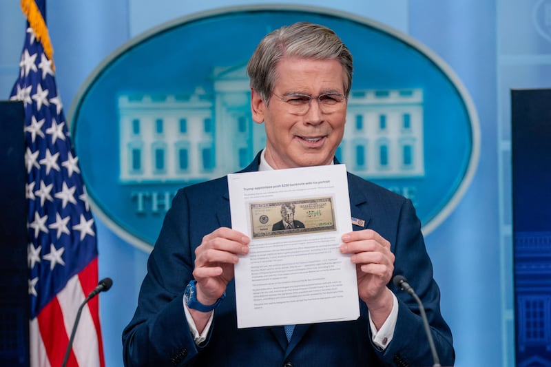 U.S. Treasury Secretary Scott Bessent holds up a Washington Post article about a possible 250 dollar bill with the portrait of U.S. President Donald Trump during a press briefing in the James S. Brady Press Briefing Room at the White House in Washington, D.C., U.S., May 28, 2026. REUTERS/Evan Vucci