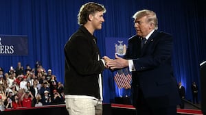 New York Giants quarterback Jaxson Dart welcomes Trump before delivering a speech about the economy at Rockland Community College Fieldhouse in Suffern, New York, on May 22, 2026.
