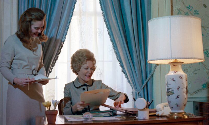 First Lady Pat Nixon and her Press Secretary Cornell Stuart at her desk in the White House on December 30, 1970