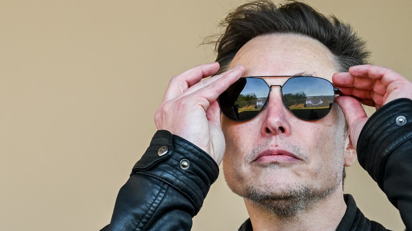 Elon Musk watches the launch of a SpaceX Starship rocket in November in Texas.