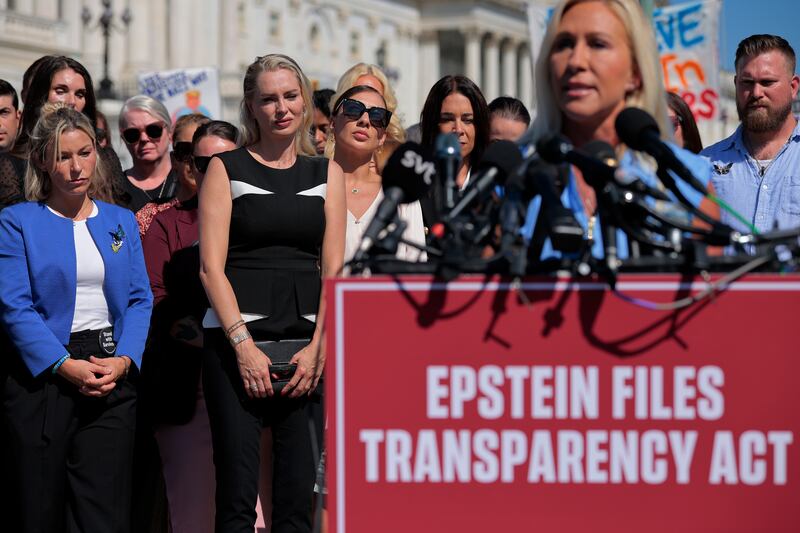 WASHINGTON, DC - SEPTEMBER 03: Some of Jeffrey Epstein's alleged victims, including (L-R) Danielle Bensky, Anouska De Georgiou, Marina Lacerda and others, listen to Rep. Marjorie Taylor Greene (R-GA) speak during a news conference with other survivors outside the U.S. Capitol on September 03, 2025 in Washington, DC. Rep. Thomas Massie (R-KY) and Rep. Ro Khanna (D-CA) have introduced the Epstein List Transparency Act to force the federal government to release all unclassified records from the cases of disgraced financier and sex trafficker Epstein and his associate, Ghislaine Maxwell.  (Photo by Chip Somodevilla/Getty Images)