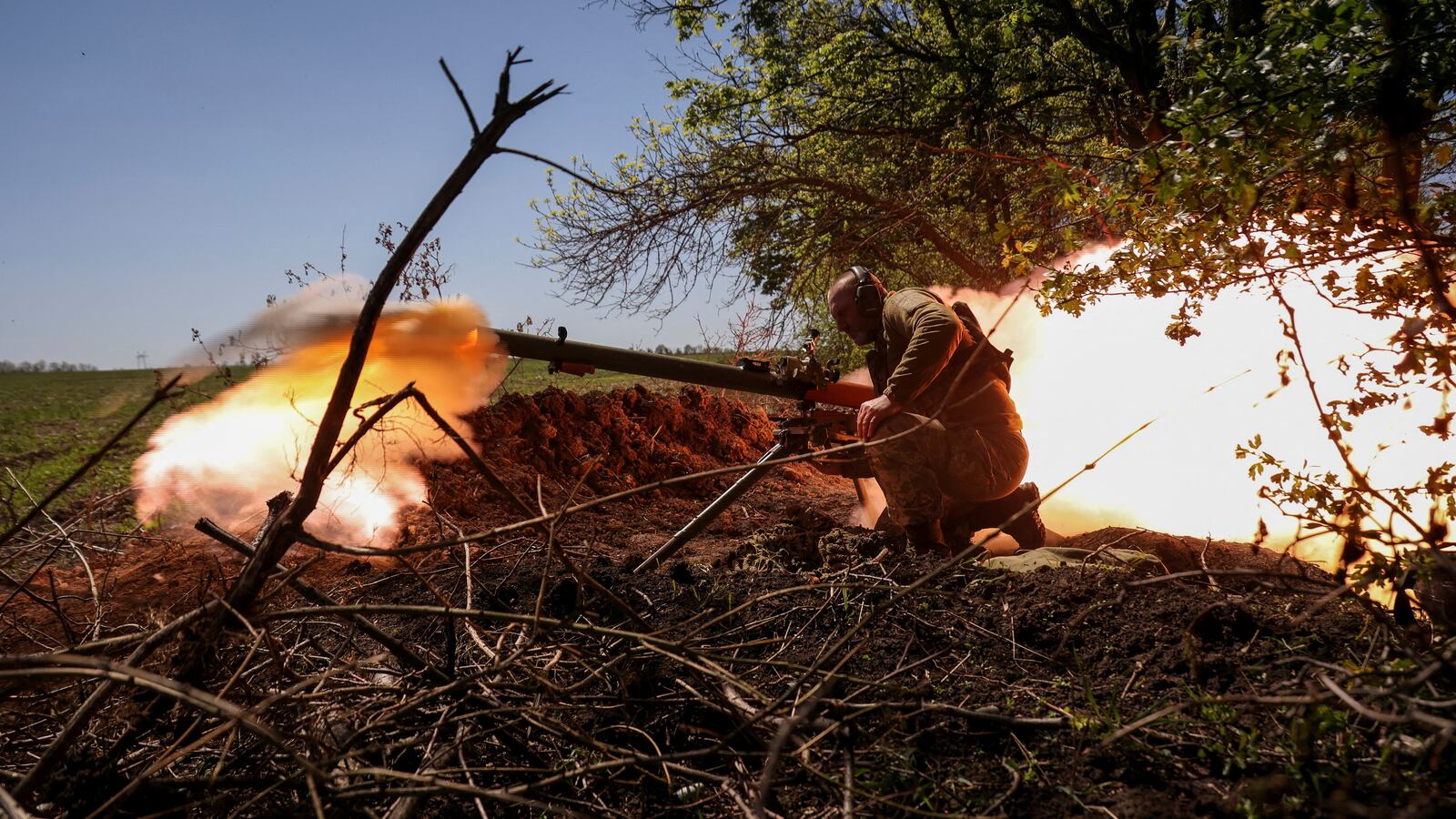 A Ukrainian service member fires an anti-tank grenade launcher at a front line near the city of Bakhmut, Ukraine, May 3, 2023.