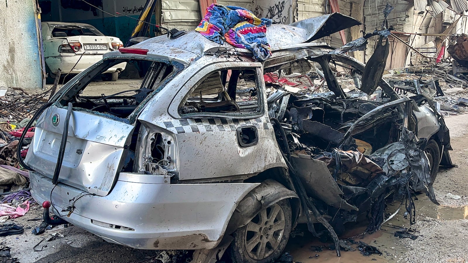 The car in which three sons of Hamas leader Ismail Haniyeh were reportedly killed in an Israeli air strike is pictured in al-Shati camp, west of Gaza City.