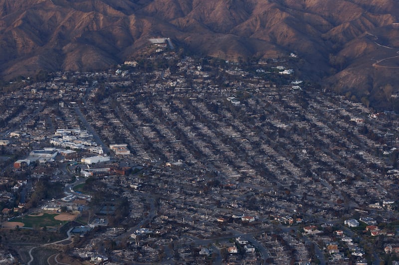 An aerial view of damage caused by the Palisades Fire is shown in the Pacific Palisades, California on January 22, 2025.