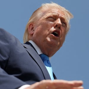 U.S. President Donald Trump speaks to members of the media as he arrives at Joint Base Andrews in Maryland, U.S., May 20, 2026. REUTERS/Evelyn Hockstein