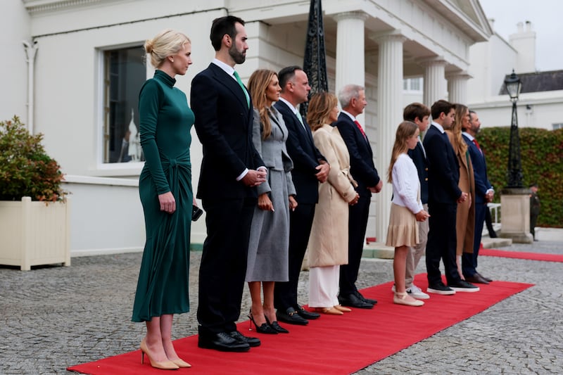 DUBLIN, IRELAND - SEPTEMBER 12: Members of the U.S. delegation, including Natalie Harp (L), executive assistant to U.S. President Donald Trump, attend an arrival ceremony on September 12, 2026 in Dublin, Ireland. U.S. President Donald Trump is on a two-day non-state visit to Ireland. Among other events today, he is holding a bilateral meeting with Taoiseach Micheál Martin at Farmleigh House in the Phoenix Park. (Photo by Anna Moneymaker/Getty Images)