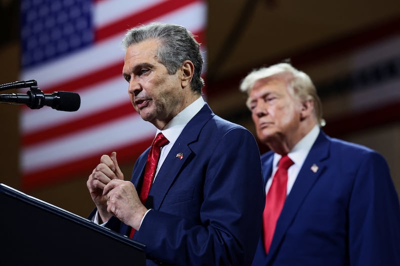Rick Jackson, a Republican candidate for governor of Georgia, speaks alongside U.S. President Donald Trump during an event at Wheeler High School in Marietta, Georgia, U.S., July 22, 2026. REUTERS/Evelyn Hockstein