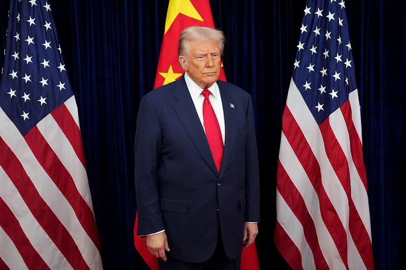 U.S. President Donald Trump prepares to greet Chinese President Xi Jinping ahead of a bilateral meeting at Gimhae Air Base on October 30, 2025 in Busan, South Korea.