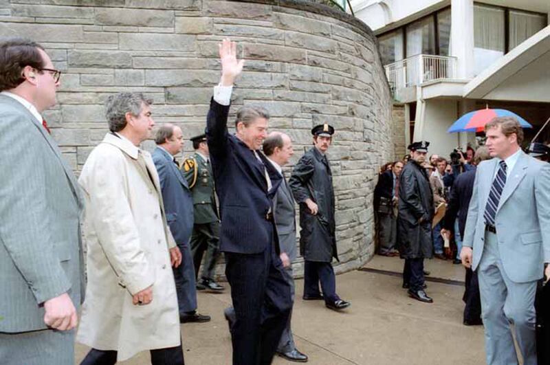 U.S. President Ronald Reagan waves to the crowd immediately before being shot outside the Washington Hilton Hotel in Washington, DC, U.S. on March 30, 1981.