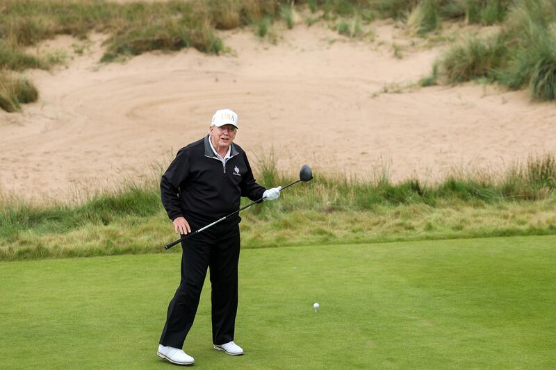 President Donald Trump tees off after opening his new golf course at his Trump International Golf links resort on July 29, 2025 in Balmedie, Scotland.