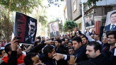 articles/2011/03/17/syrian-protesters-attacked-by-regime-thugs-in-cairo-thx/giglio-syrian-protest_167210_kdzvtx