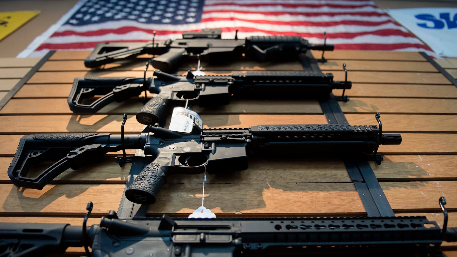 Assault rifles hang on the wall for sale at Blue Ridge Arsenal in Chantilly, Virginia, on October 6, 2017.