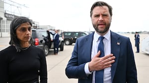 U.S. Vice President JD Vance speaks to the press as second lady Usha Vance looks on at Minneapolis Saint Paul International Airport after paying their respects to victims of the Annunciation Catholic Church shooting on September 3, 2025 in St Paul, Minnesota.
