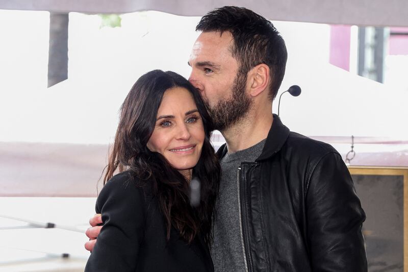 Actor Courteney Cox and musician Johnny McDaid pose during Courteney Cox's star unveiling ceremony on the Hollywood Walk of Fame in Los Angeles, California, U.S., February 27, 2023.