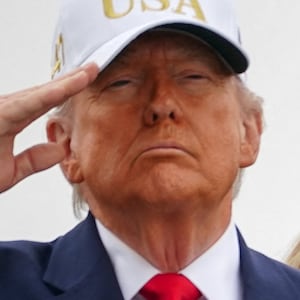 U.S. Special Envoy Steve Witkoff stands behind President Donald Trump and first lady Melania Trump during the transfer of the remains of six U.S. Army service members who were killed in Kuwait.