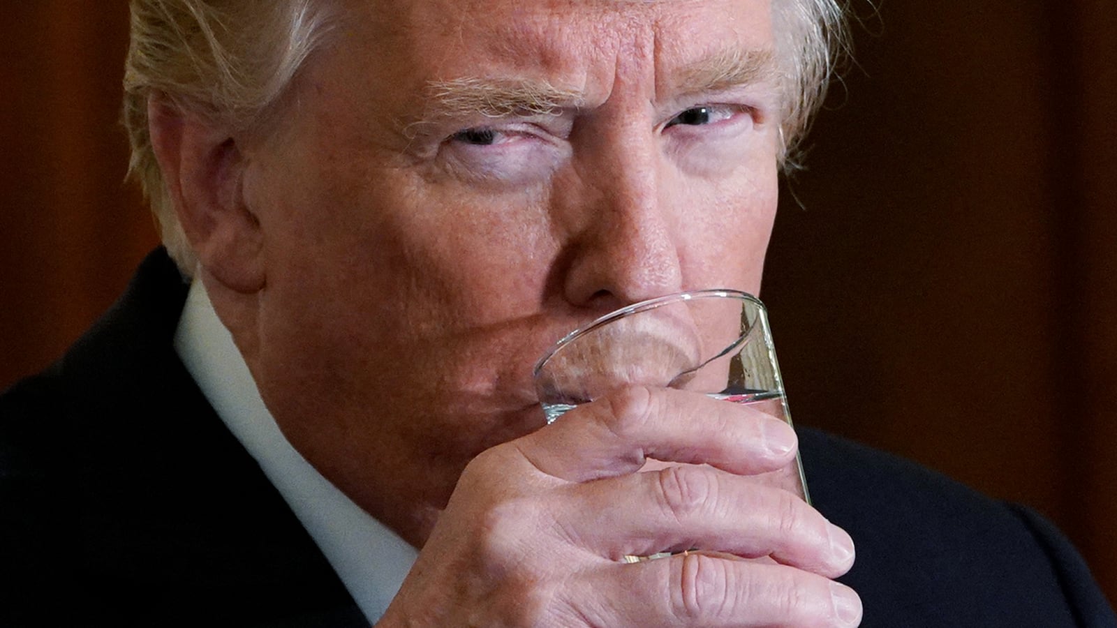 US President Donald Trump takes a sip of water during a joint press conference with Sweden's Prime Minister Stefan Löfven in the East Room of the White House on March 6, 2018 in Washington, DC. (Photo by MANDEL NGAN / AFP) (Photo by MANDEL NGAN/AFP via Getty Images)