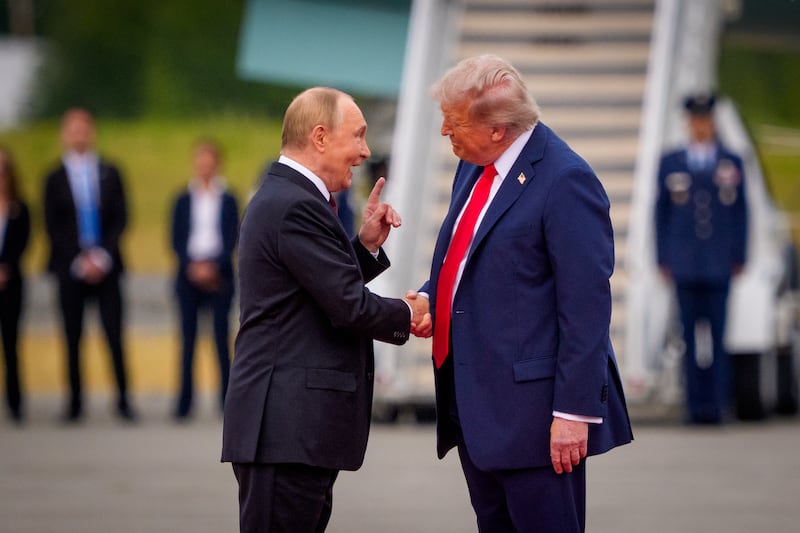 U.S. President Donald Trump greets Russian President Vladimir Putin as he arrives at Joint Base Elmendorf-Richardson on August 15, 2025 in Anchorage, Alaska. The two leaders were meeting for peace talks aimed at ending the war in Ukraine.