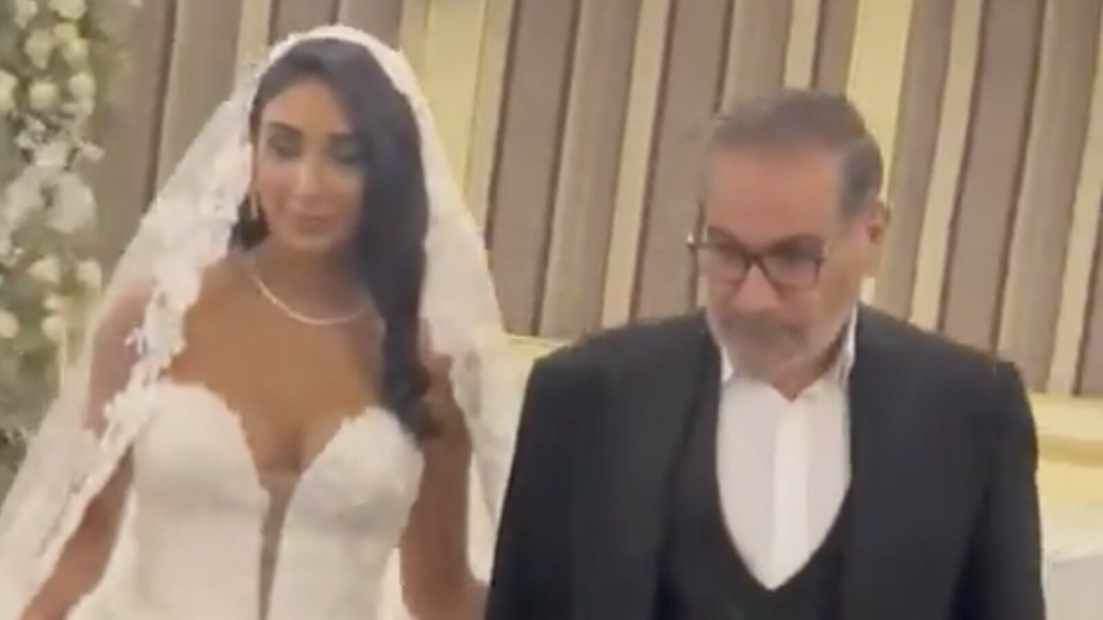 Ali Shamkhani escorting his daughter—wearing a strapless gown—into a luxury Tehran hotel ignited fury over hijab crackdowns.