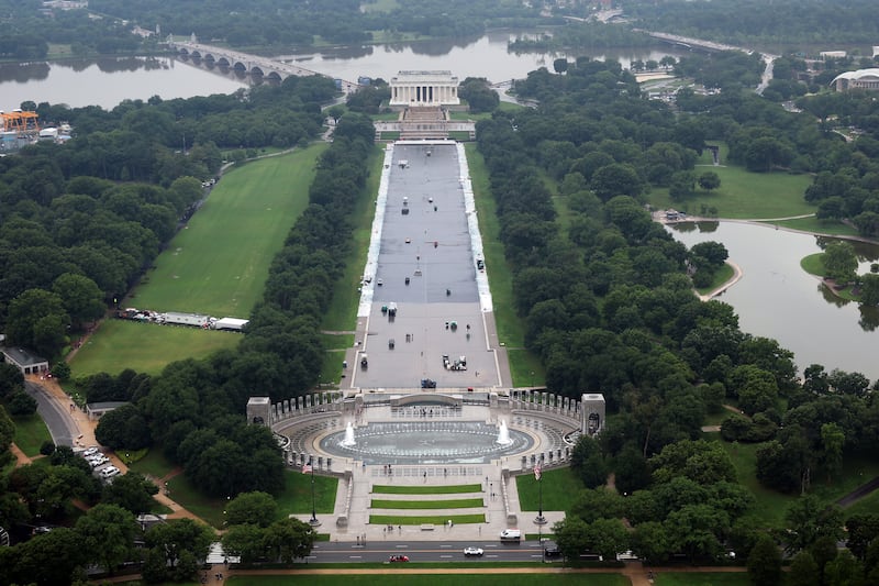 Workers continue to paint the bottom of the Lincoln Memorial Reflecting Pool on the National Mall on May 26, 2026 in Washington, DC as Trump claims he also wants to paint the fountain at the WWII Memorial.