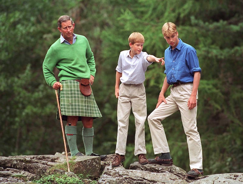 Prince Charles is pictured with his sons, Prince  William and Prince Harry, at Glen Muick on the Balmoral Castle Estate in Scotland on August 16, 1997.