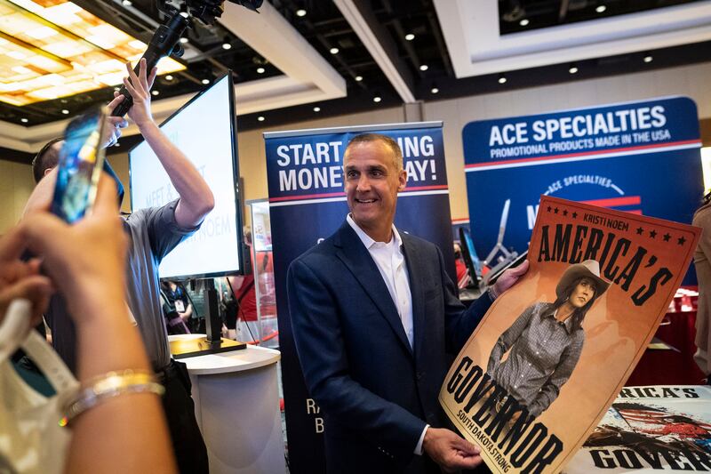 Corey R. Lewandowski holds a poster of Kristi Noem during the Conservative Political Action Conference CPAC held at the Hyatt Regency Orlando on Saturday, Feb 27, 2021 in Orlando, FL.