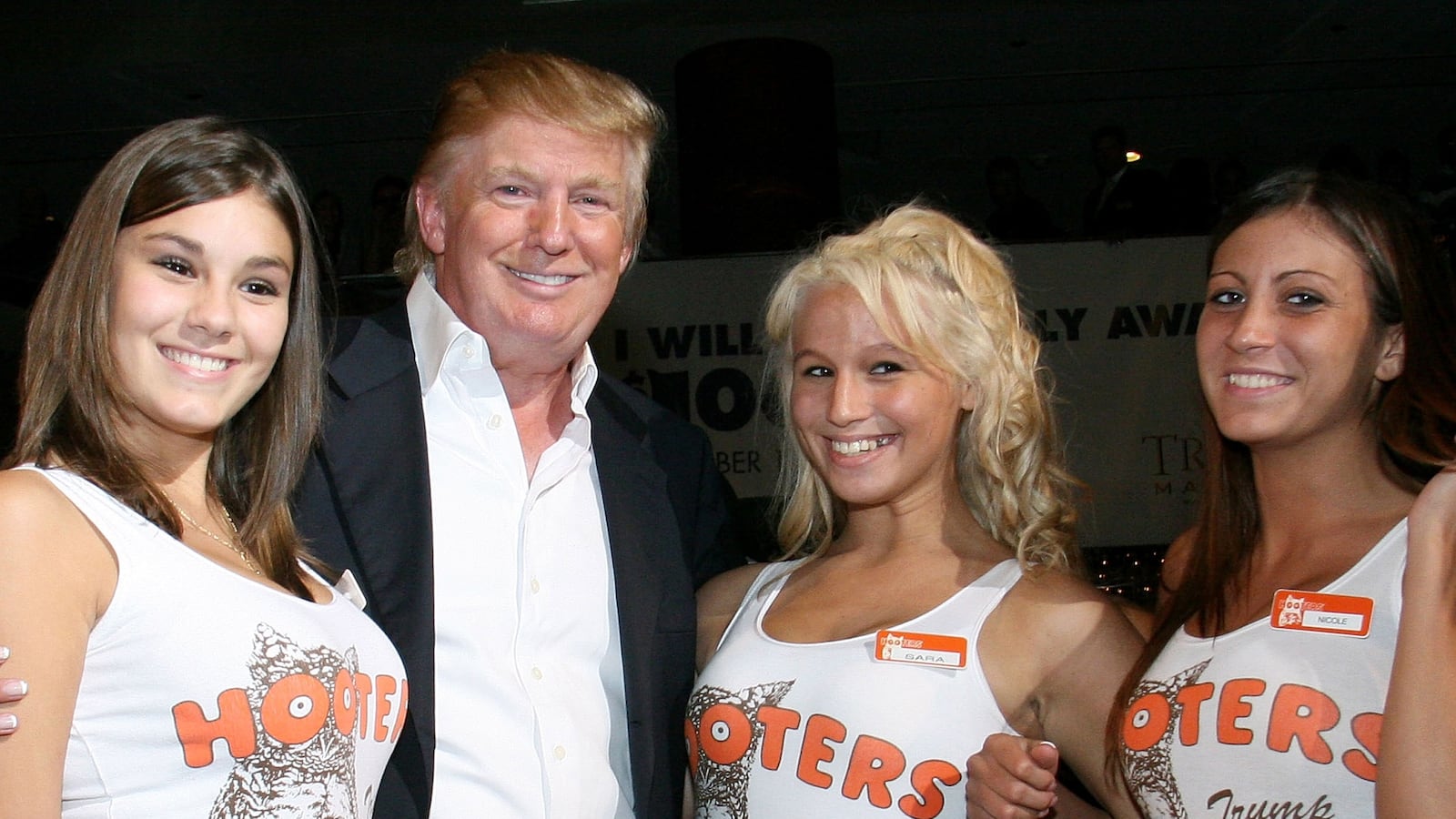 Guess who? Donald Trump poses with "Hooters Girls" at the Trump Marina and Casino in Atlantic City in 2007.