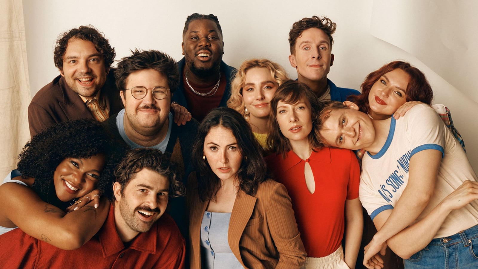 SNL Cast standing together.