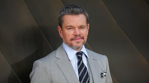 Matt Damon smiles on the red carpet at the world premiere of “The Odyssey" in 2026.