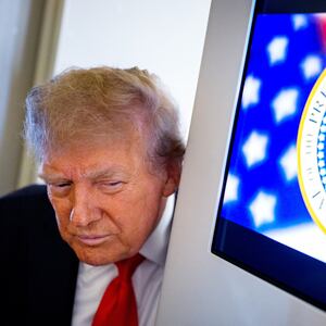 President Donald Trump takes a question from a reporter aboard Air Force One on August 15, 2025, in flight.