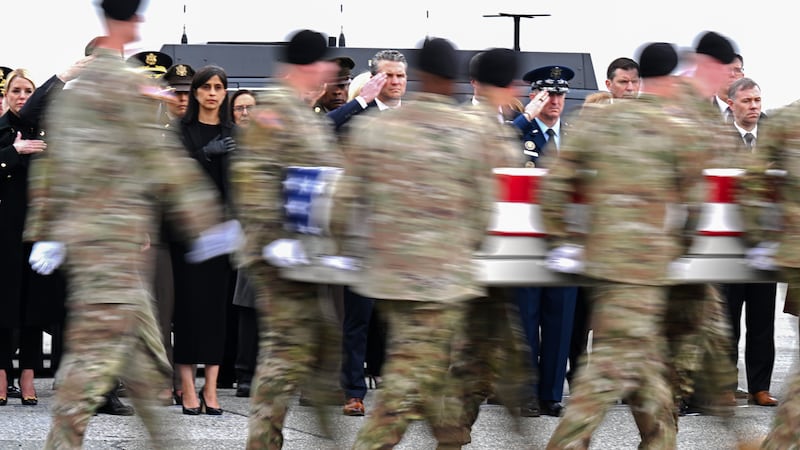 (L-R) Second lady Usha Vance and U.S. Secretary of War Pete Hegseth salute as a U.S. Army carry team moves a flag-draped transfer case containing the remains of  Sgt. 1st Class Noah L. Tietjens at Dover Air Force Base March 07, 2026 in Dover, Delaware.