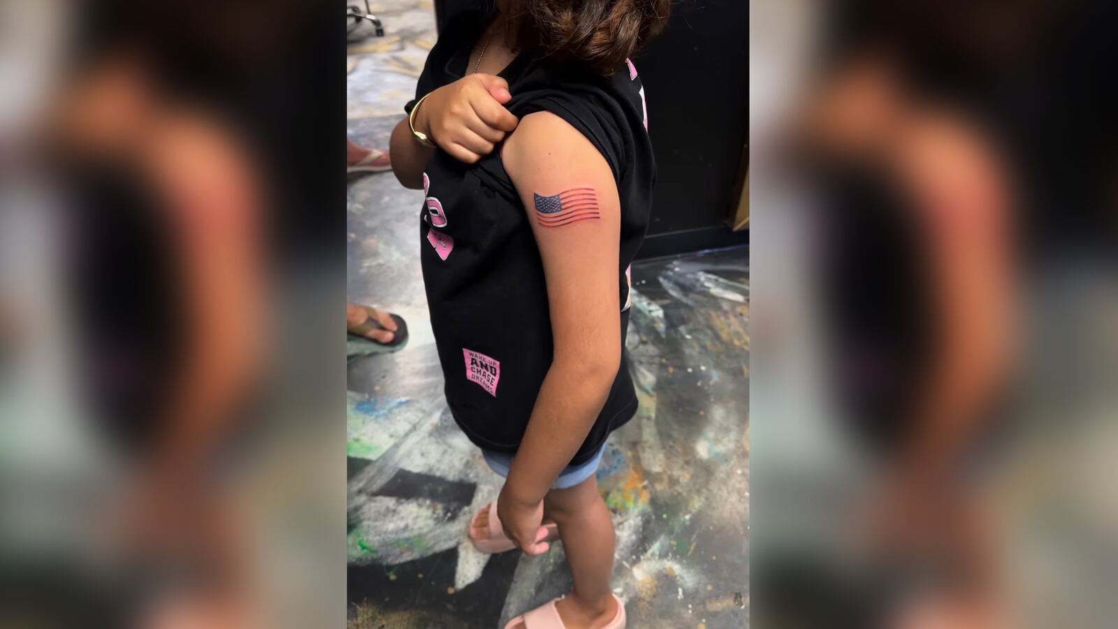 9-year-old girl gets permanent tattoo of American flag.