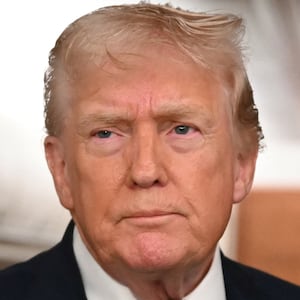 US President Donald Trump speaks to the press aboard Air Force One on January 11, 2026. Trump said Sunday his administration was working well with Venezuela's interim leader Delcy Rodriguez and that he would be open to meeting with her. (Photo by ANDREW CABALLERO-REYNOLDS / AFP via Getty Images)