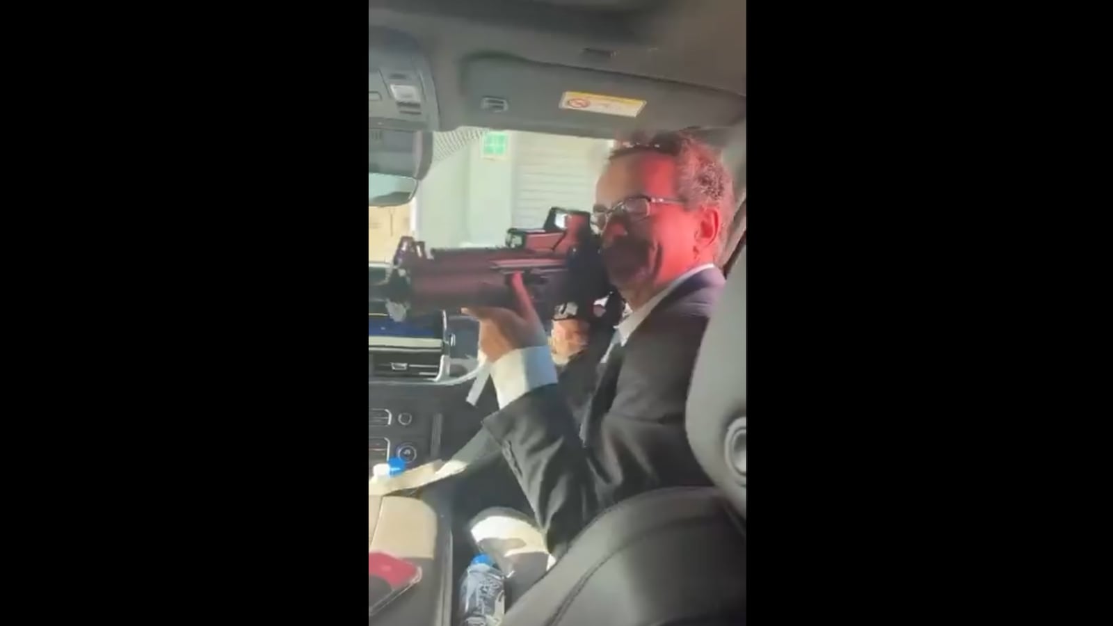 Jon Benjamin, British Ambassador to Mexico, pointing semi-automatic machine gun at Mexican staff member in video shared to X by @subdiplomatic
