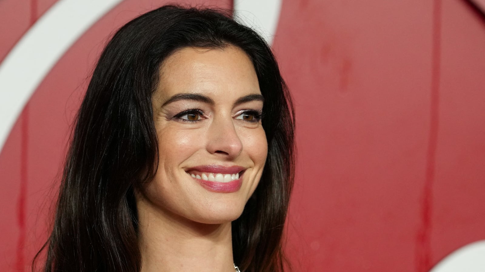 Anne Hathaway poses on the red carpet of the annual Fashion Awards at the Royal Albert Hall in London, Britain, December 4, 2023.