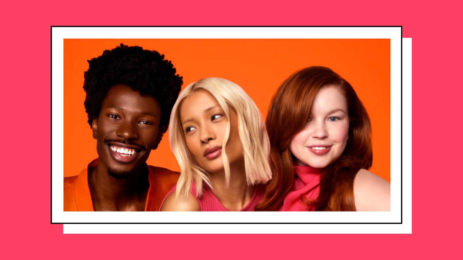 Three people posing on an orange background. The first person has dark black hair, the second has blonde hair, and the third has red hair.