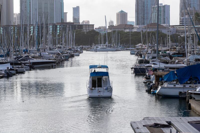 A boat leaves the Ala War Harbor, Waikiki, Oahu, Hawaii.