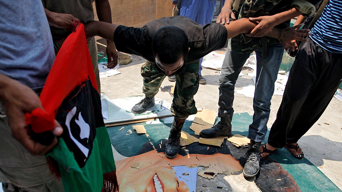 articles/2011/08/24/libya-news-rebels-put-bounty-on-gaddafi-s-head/libya-rebels-qaddafi-kossov_bditc5