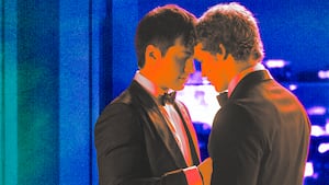 A photo illustration of Hudson Williams and Connor Storrie in Heated Rivalry.