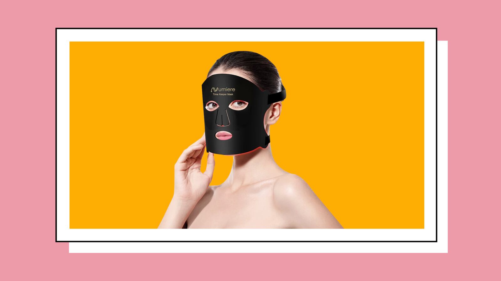 Woman wearing the Lumina LED Therapy Mask, its black. The woman is on an orange background.