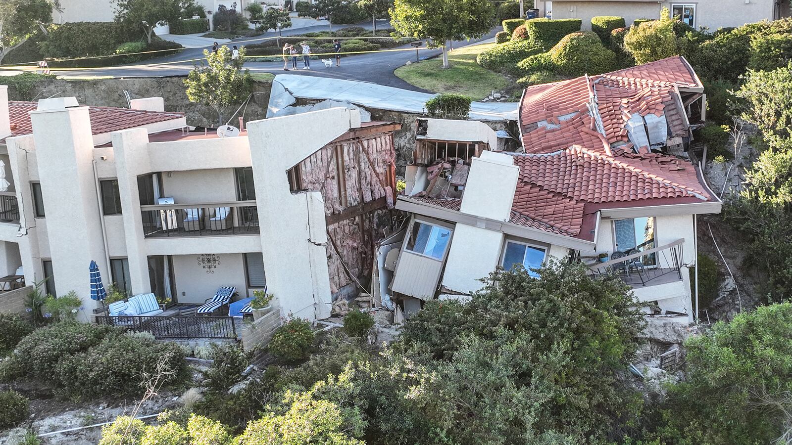 A picture of homes n the Rolling Hills Estates in California collapsing. Twelve homes are expected to crash to the bottom of the canyon due to a massive landslide that hit the area on Saturday.