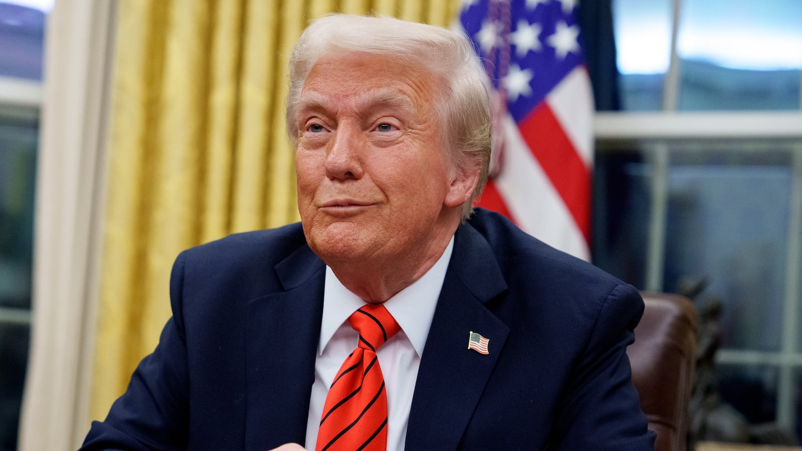U.S. President Donald Trump reacts to a question from a reporter after signing a series of executive orders in the Oval Office at the White House on February 10, 2025 in Washington, DC.