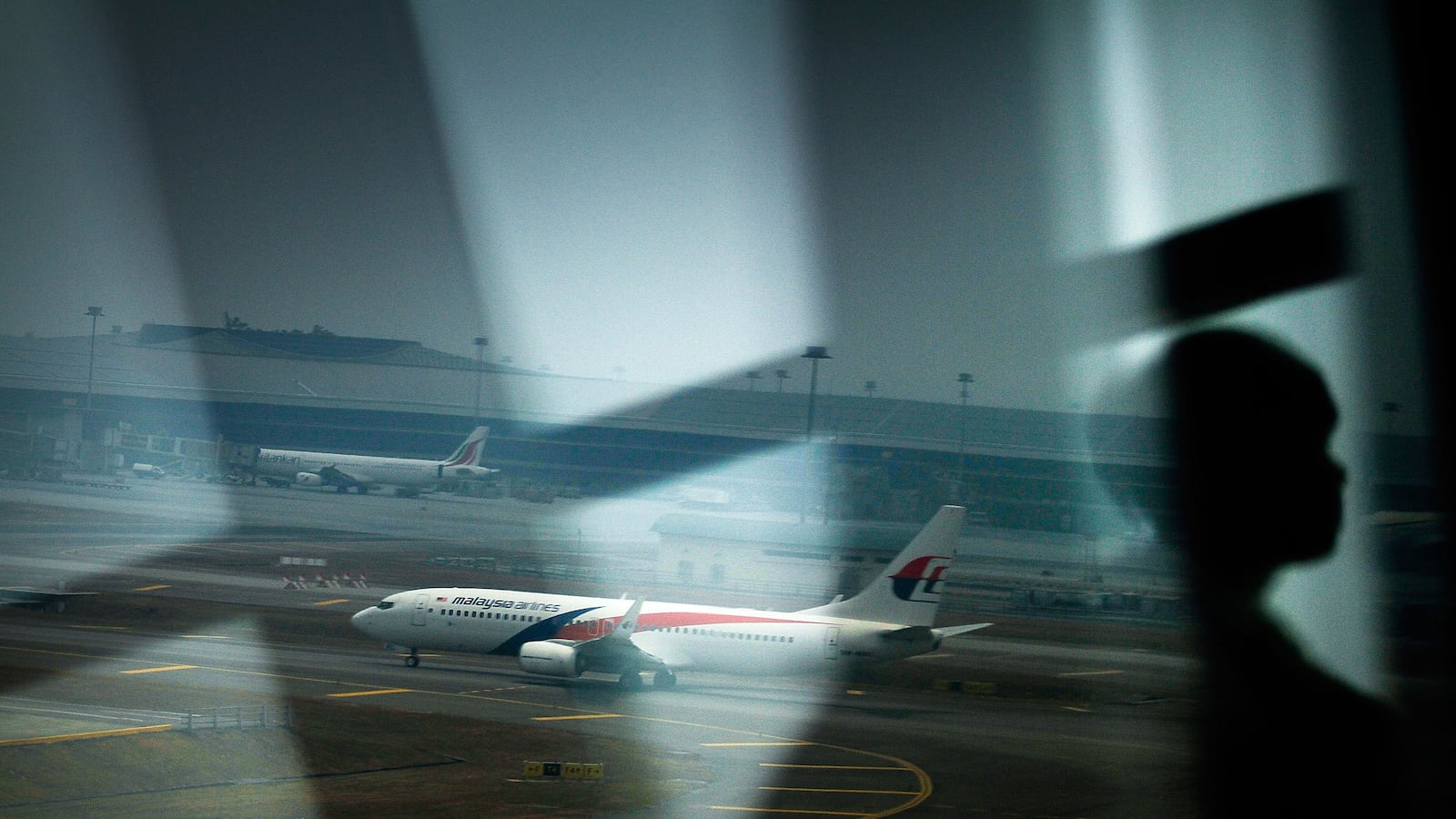 articles/2014/03/12/the-craziest-malaysia-airlines-flight-370-conspiracy-theories/140312-dickson-conspiracy-tease_zhccf2