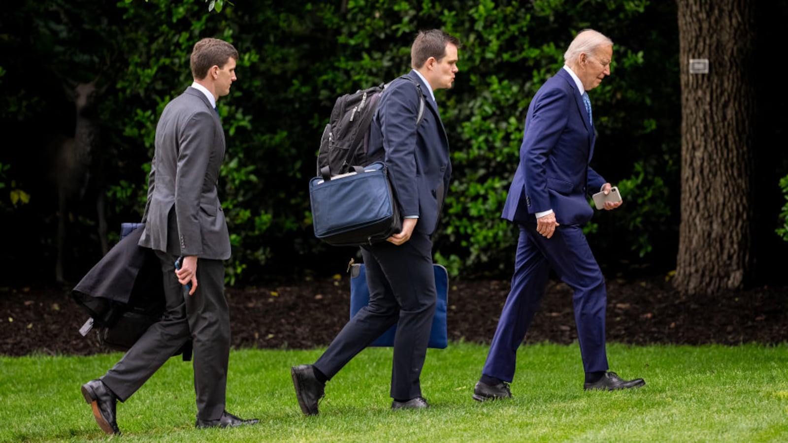President Joe Biden, accompanied by his personal aide Jacob Spreyer (C) and Assistant to the President & Director of Oval Office Operations Richard Ruffner (L), arrive at the White House.
