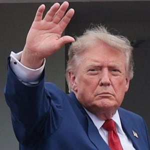 U.S. President Donald Trump waves as he boards Marine One as he departs SPIRE Academy, en route to Cleveland Hopkins International Airport, in Geneva, Ohio, U.S., August 11, 2026.