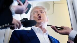 US President Donald Trump speaks to reporters about the Israel-Iran conflict, aboard Air Force One on June 24, 2025, while traveling to attend the NATO's Heads of State and Government summit in The Hague in the Netherlands. (Photo by Brendan Smialowski / AFP) (Photo by BRENDAN SMIALOWSKI/AFP via Getty Images)