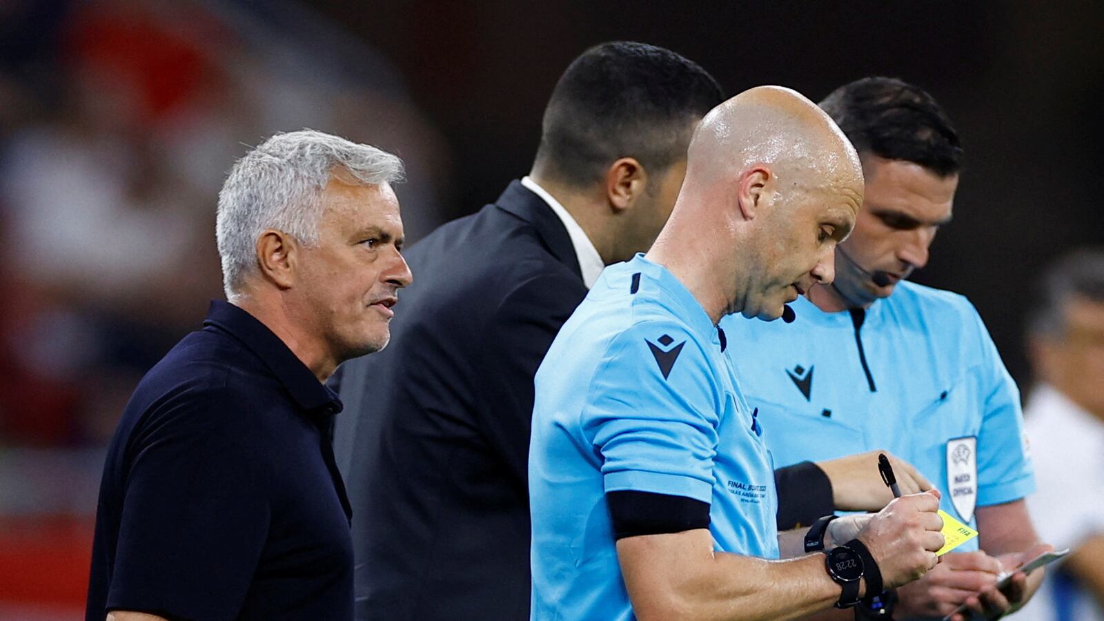 Roma coach Jose Mourinho remonstrates with referee Anthony Taylor after losing the final.